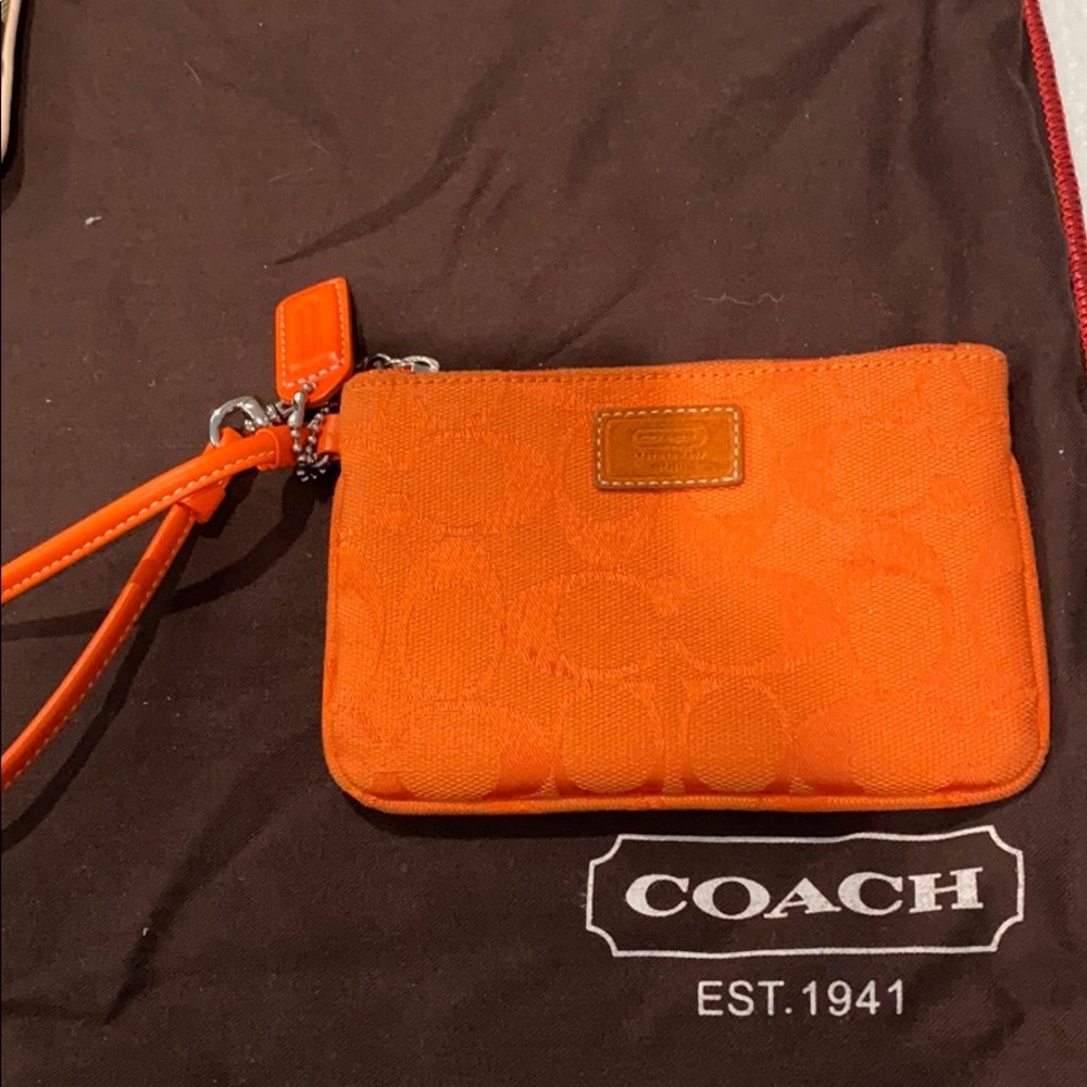 Coach orange monogram wristlet